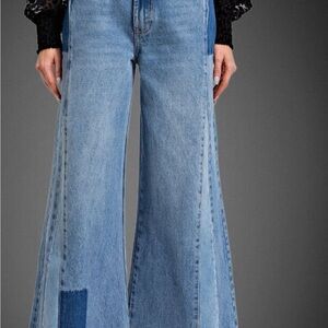 Blue patchwork wide leg bell bottoms by easel.